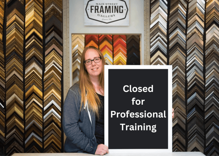Image of Jennifer holding sign that says closed for Professional Training